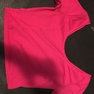 A pink off the shoulders crop top